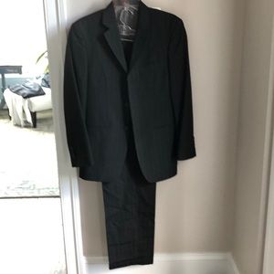 Black and light white pin stripe suit.